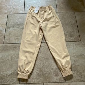 The brand is Zara and they have never been worn!